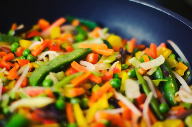 stir fry with bright colored vegetables and greens