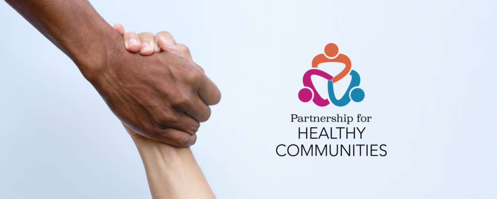 two hands shaking with the partnership for healthy communities logo