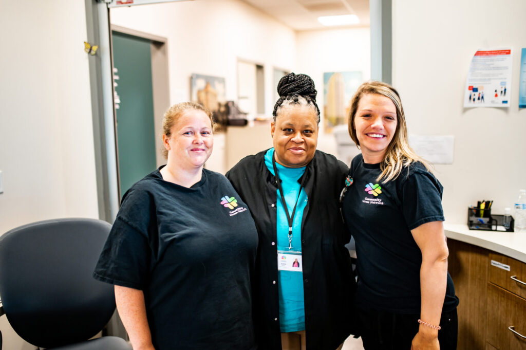 three team members at community access network